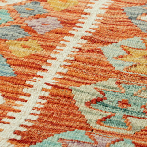 Close-up of a colorful woven textile with geometric pattern