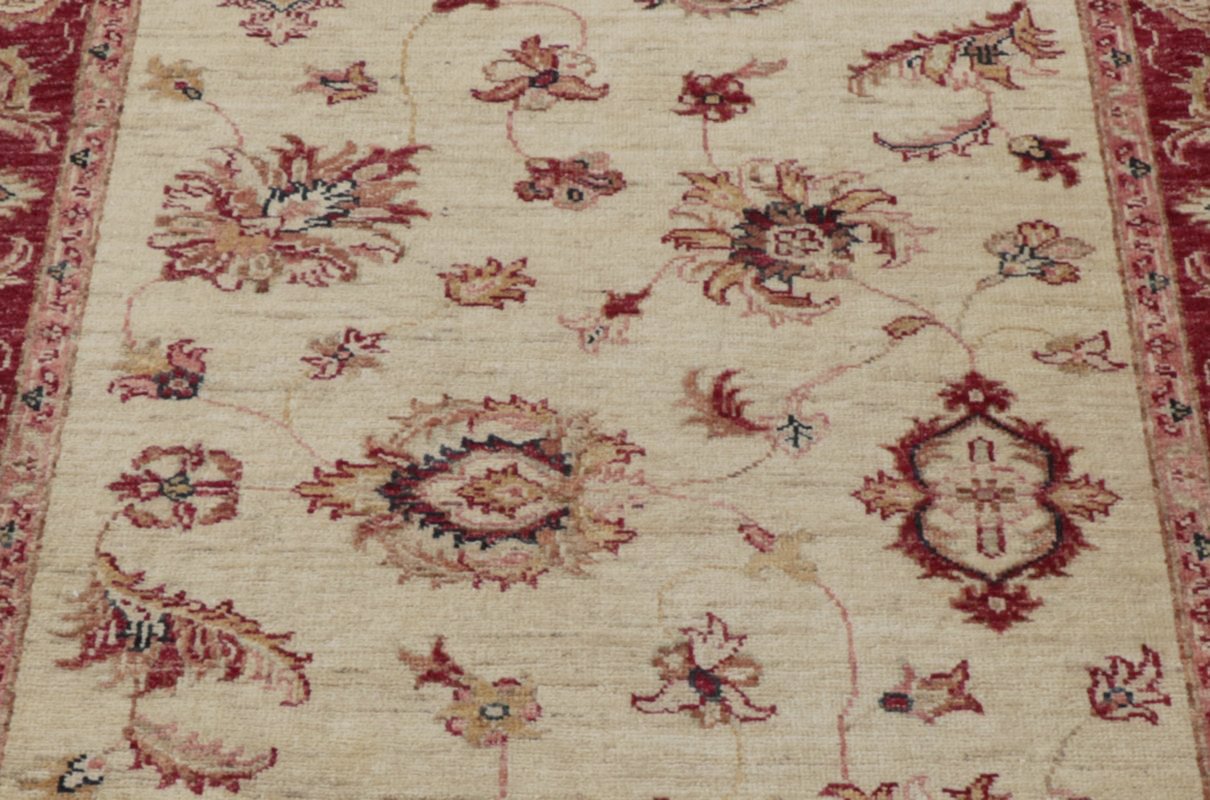 A hand knotted Ziegler runner with an arts and craft influence.